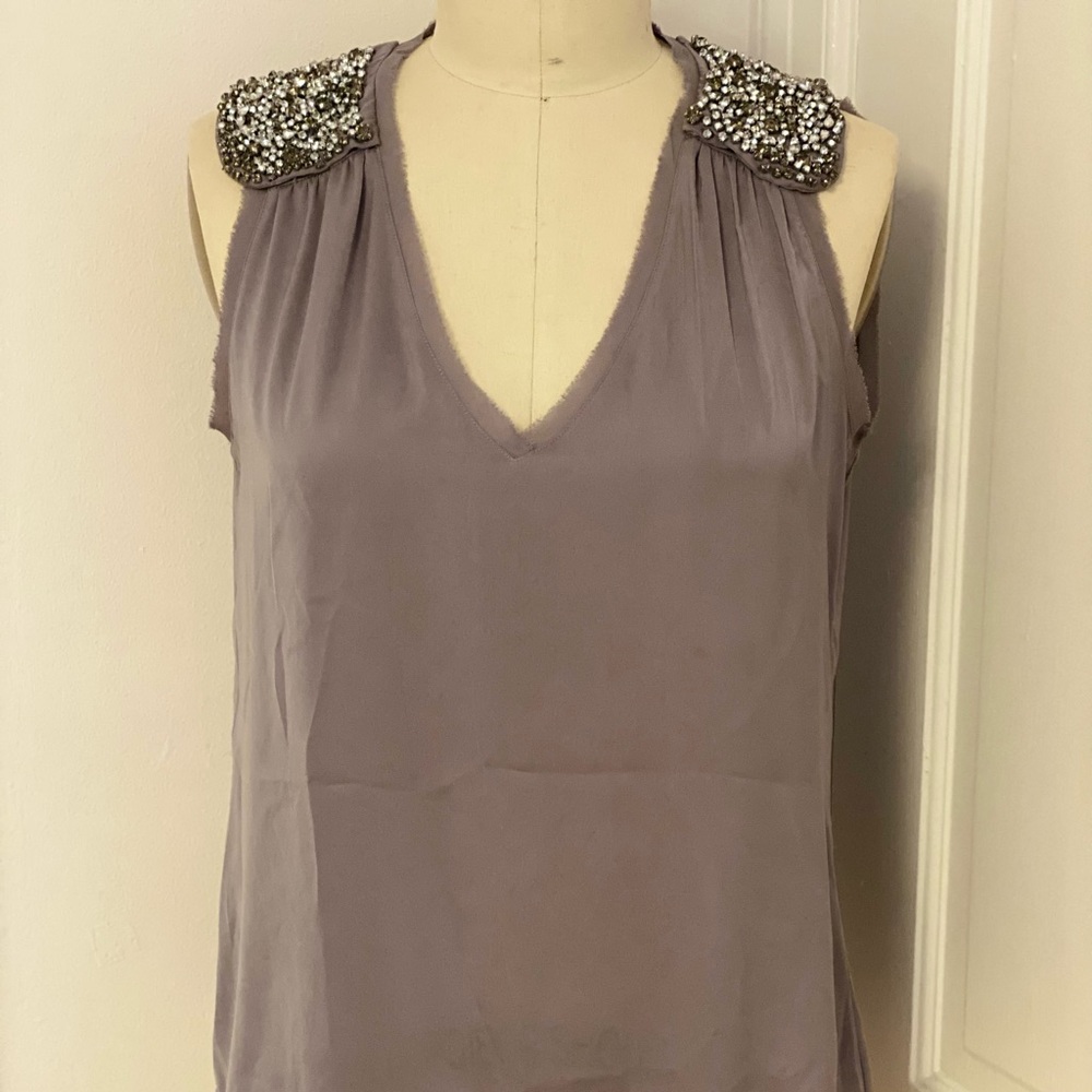 Grey sleeveless blouse with rhinestones on shoulders